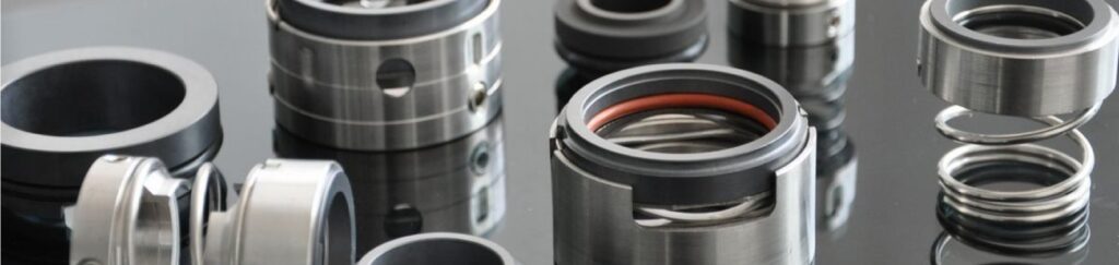Assorted mechanical seals and components for industrial pumps and rotating equipment on reflective surface